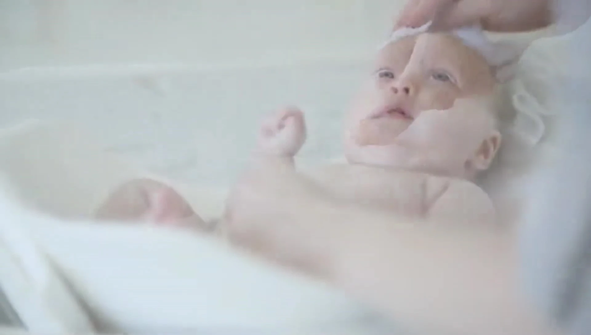 Mother and baby in the Pudge Tub, emphasizing the bonding aspect