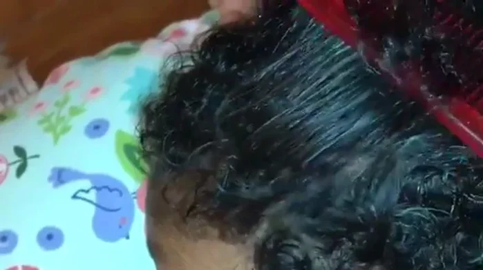 Comb through the hair to ensure even distribution and to check for any missed areas.