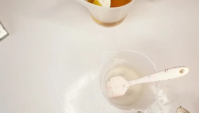 Combine Lye Solution and Oils: Combine the lye solution with the oil mixture.