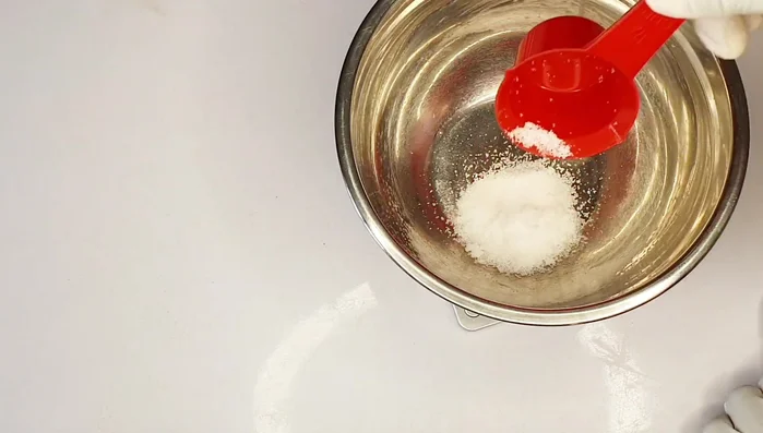 Prepare Lye Solution: Carefully mix measured caustic soda (lye) into clean water, stirring gently until completely dissolved. Ensure the mixture is clear.