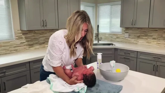 Wrap baby in a dry towel.