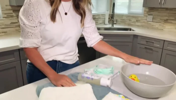 Fill tub with warm water (check temperature with thermometer).