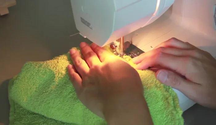 Zigzag stitch over the seam allowance to prevent fraying and ensure washability. Adjust stitch length for desired density.