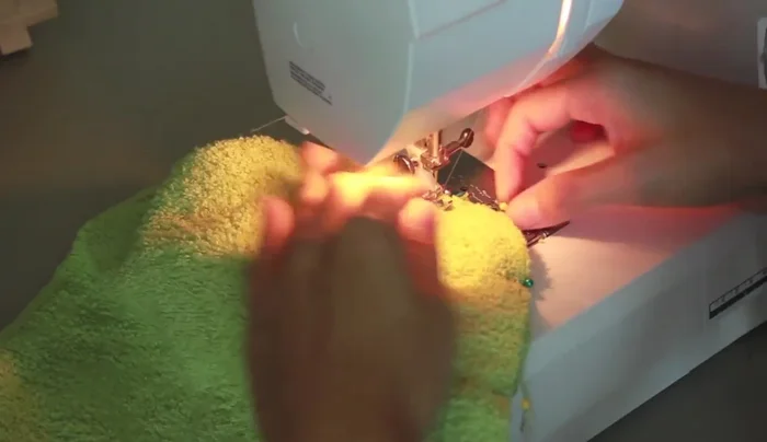 Zigzag stitch over the seam allowance to prevent fraying and ensure washability. Adjust stitch length for desired density.