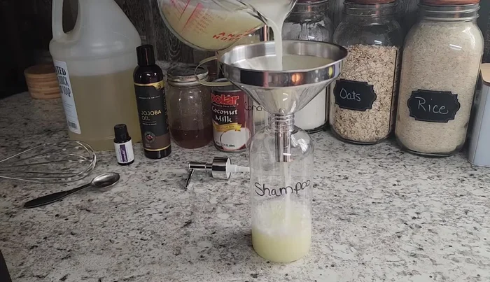 Pour the shampoo into a bottle.