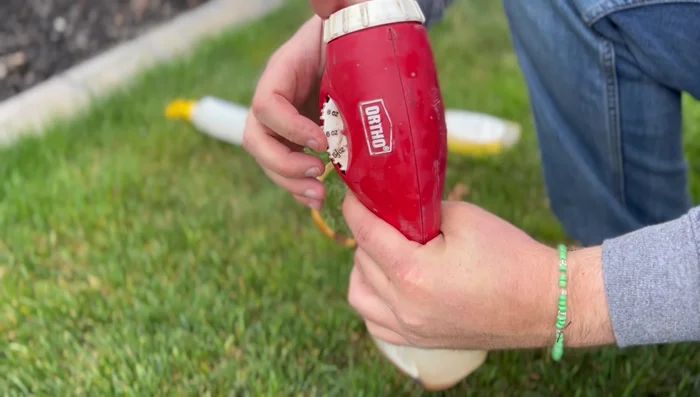 Apply the solution to your lawn. Use a 3-6 ounce setting on your sprayer, depending on how fast you walk. Slower walking allows for more thorough soaking. This video uses a 3-ounce setting and a shower-head type nozzle for the first pass.